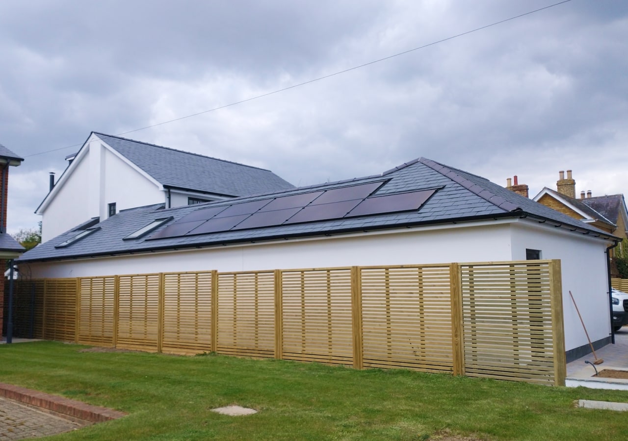 Embedded in-roof 3.24kW array on garage roof with Tesla
                Powerwall battery